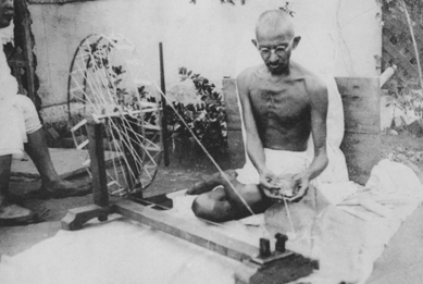 Mahatma Gandhi spinning with a charkha